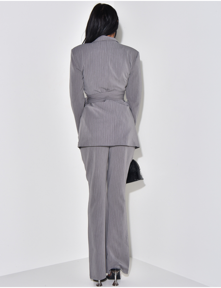 Striped suit with wide belt and flared trousers